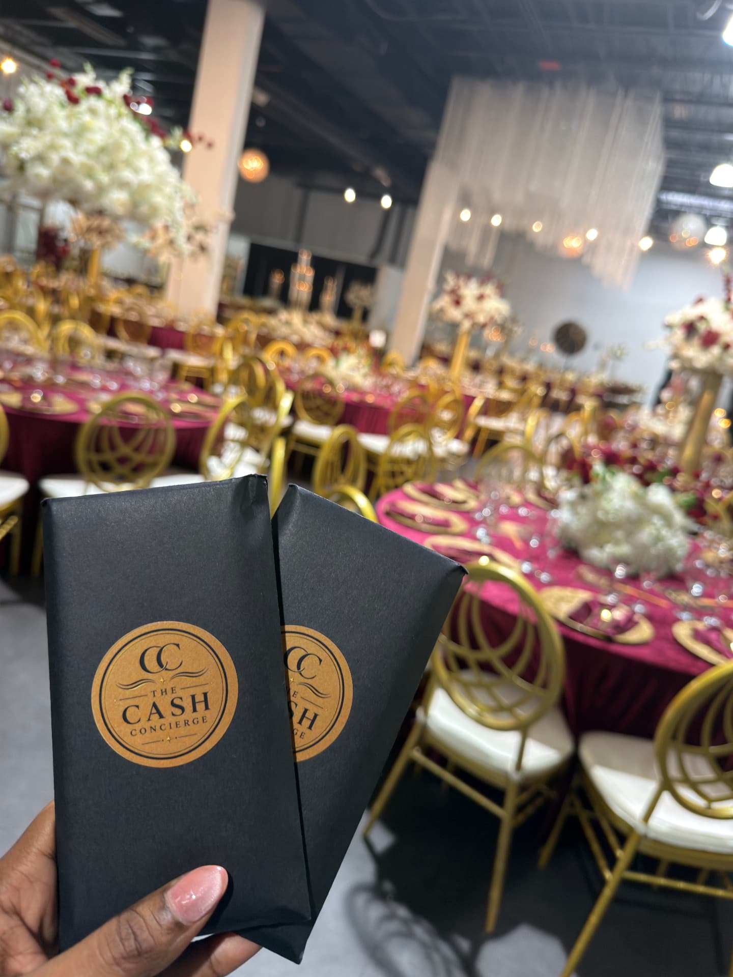 Branded Cash Concierge money bags at an elegant reception